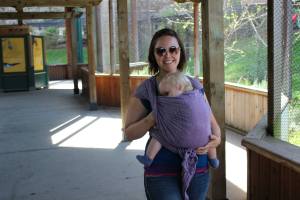 Emily an educator with BWI Bay Area nursing in a Kangaroo Carry