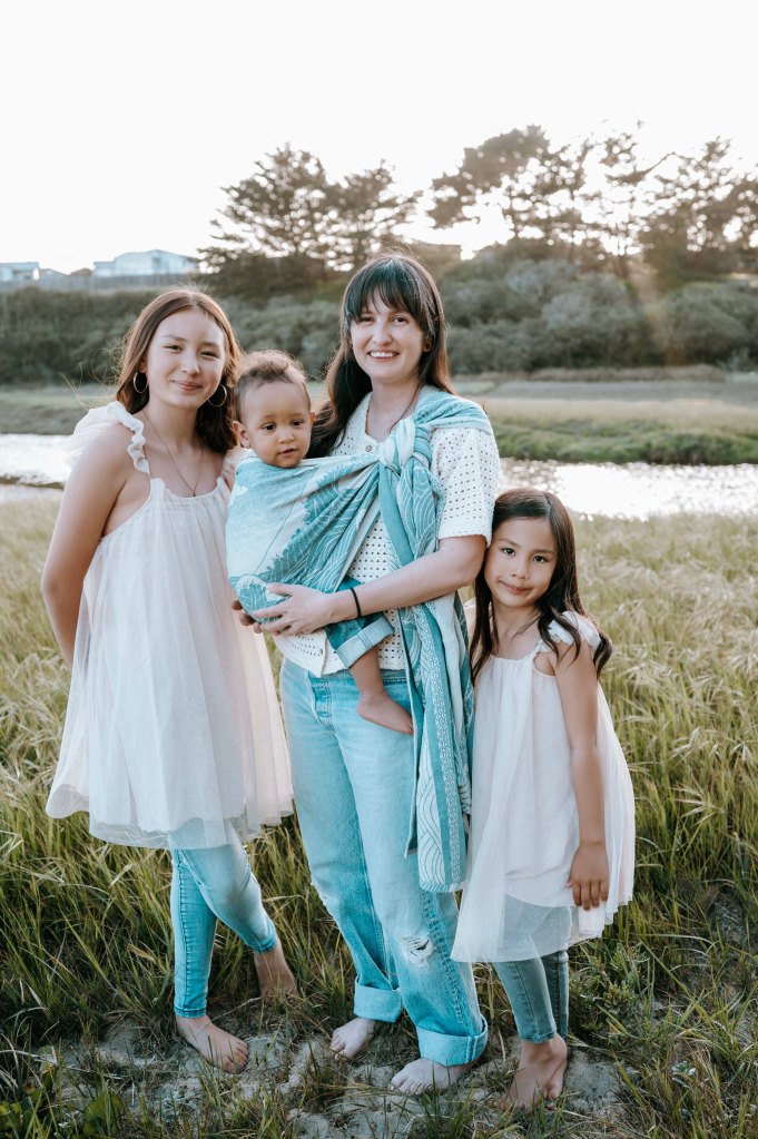 Jay and Family pose by the beach